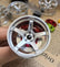 Advan GT style mini wheel & brake caliper car air freshener, close-up detail of caliper and rim – RimLabs